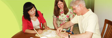 Our clients learning to cook Chinese food