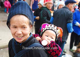 A granny with her grandson after shopping in the market