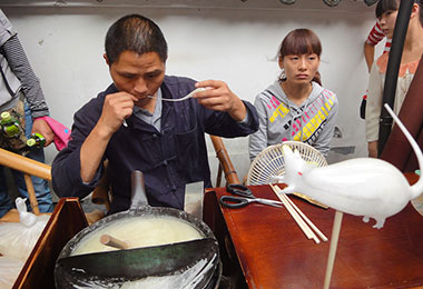 Folk artist is making sugar figure