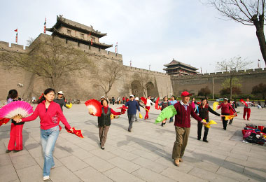 Locals are dancing in the City Wall Park