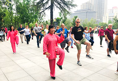 Our group learning Tai Chi with locals
