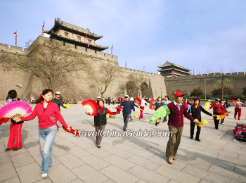 Locals are dancing in the City Wall Park