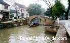 Boats with canopy are popular among visitors in Tongli Town, Suzhou.