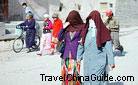 Muslim women veil their faces when walking on the street