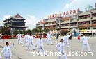 A performance of Tai Chi Quan staged on the playground by a group of Chinese people.