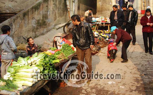 The man is asking for the price of the greens.