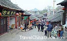A street in Qingyan Old Town with stores along the both sides selling special local products and local snacks, Guizhou.