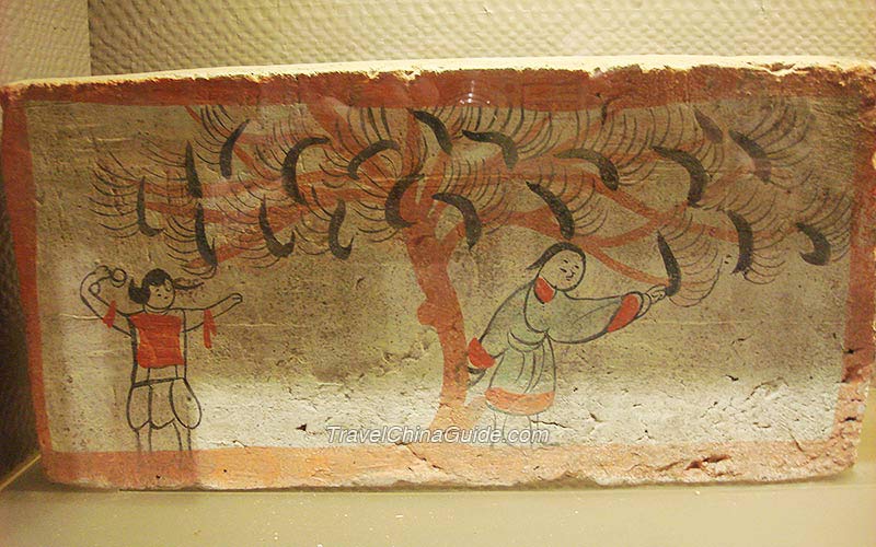 Painted Brick (replica) of the Jin Dynasty (265-420): During the Wei and Jin Dynasties, Silk was produced in northwest China. Mulberry trees were cultivated intensively in the regions of present-day Gansu and Xinjiang. The painting shows the gathering of mulberry leaves by members of non-Han Chinese ethnic groups who lived in the Gansu Corridor