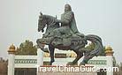 The vivid statue of Genghis Khan''s riding on horse back in front of the mausoleum.