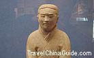 The frowned pottery figurine squatting on the ground, Qin dynasty, Shaanxi Provincial History Museum.