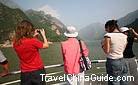 Tourists take photos when they see the elegant Wu Gorge.