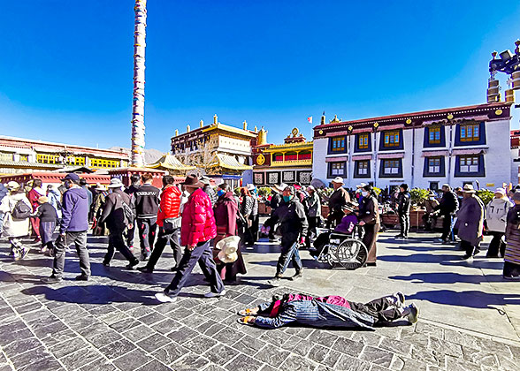 Pilgrims Kowtow devoutly at Jokhang Monastery