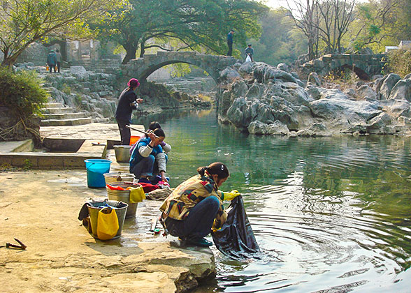 Local People Washing Clothes by the River