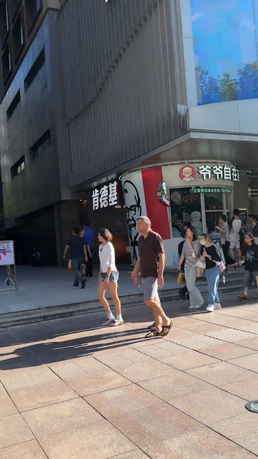 Strolling on Nanjing Road Pedestrian Street on a Clear Day